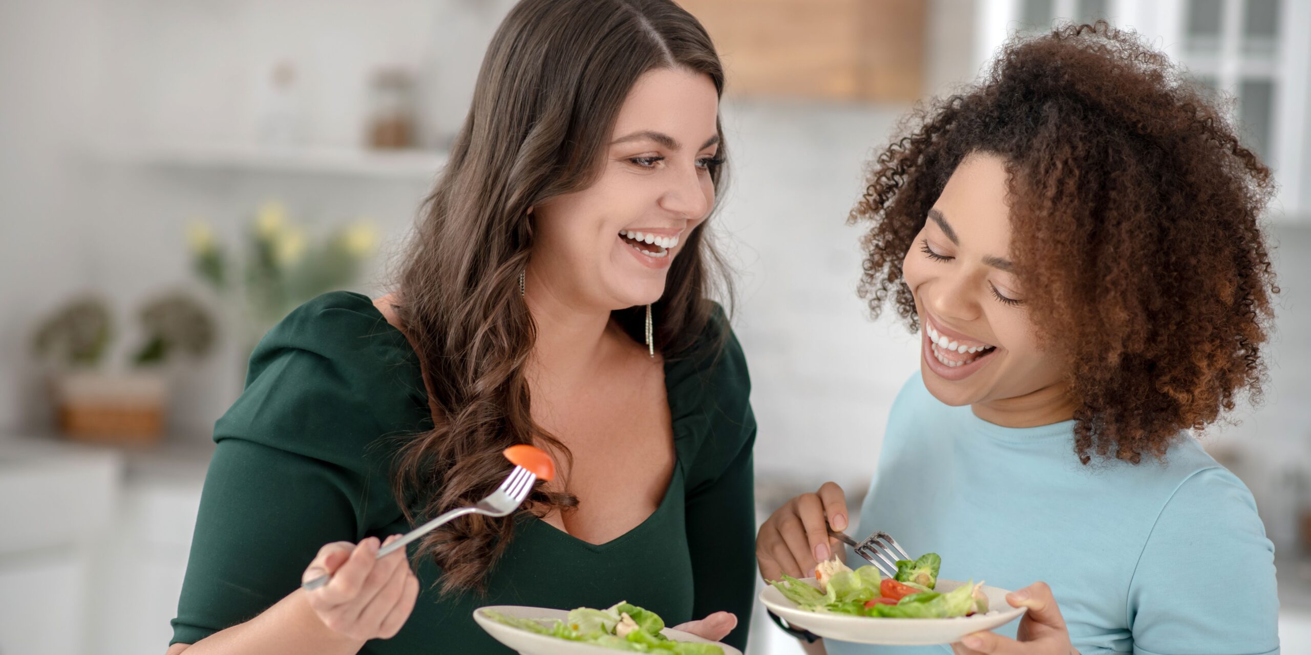 women eating salad 